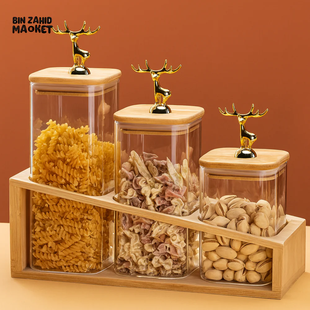 3-PIECE GLASS STORAGE JAR SET WITH WOODEN BASE & GOLDEN DEER LID HANDLES – AIRTIGHT KITCHEN ORGANIZER FOR PASTA SNACKS & DRY FOOD