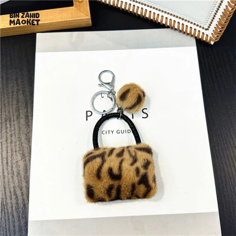 LEOPARD PATTERN BAG KEYCHAIN WITH FLUFFY BEAD — BACKPACK PHONE & CAR ACCESSORY - Image 5